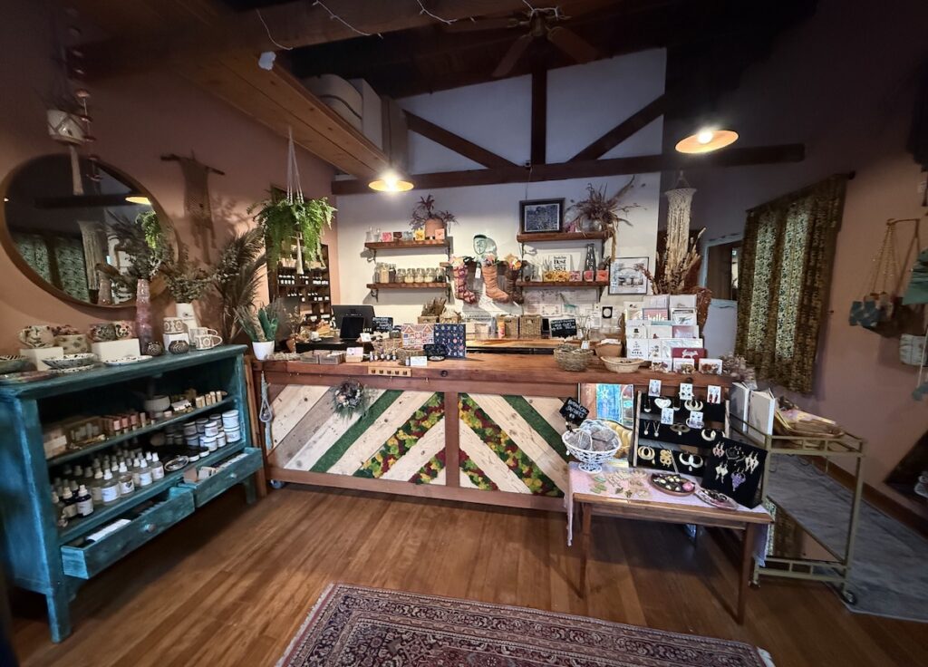 The interior of a store with lots of wood accents, including the front desk.
