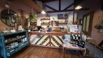 The interior of a store with lots of wood accents, including the front desk.