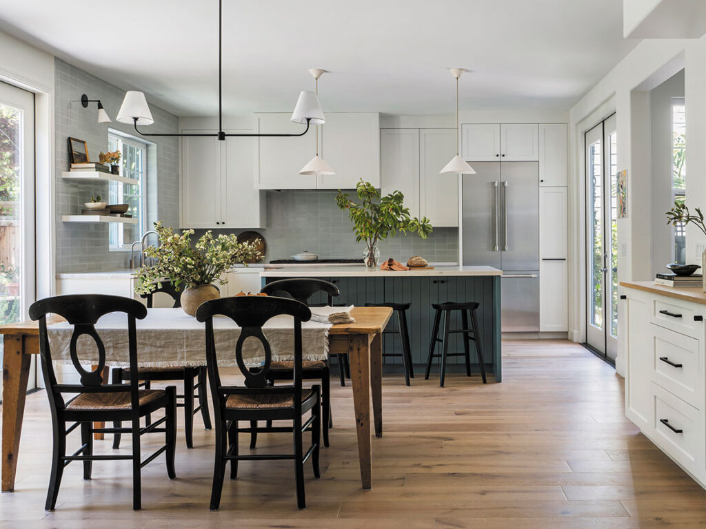 A spacious kitchen showcasing a dining table with chairs, ideal for family gatherings and meals.
