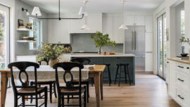 A spacious kitchen showcasing a dining table with chairs, ideal for family gatherings and meals.