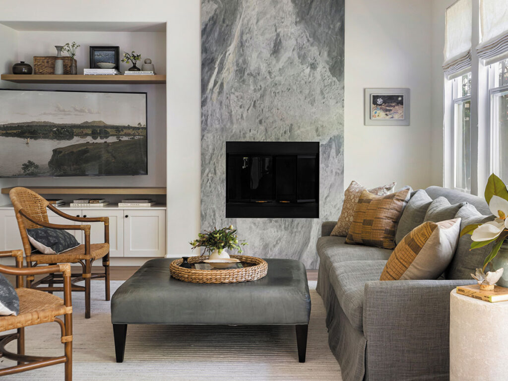 A cozy living room featuring a fireplace and a comfortable couch, creating a warm and inviting atmosphere.