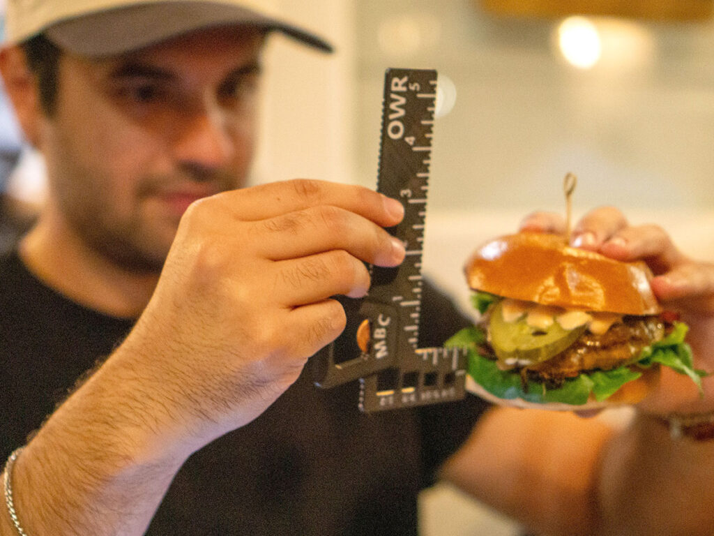 Measuring various aspects of a burger with their patent-pending Burgermajigger