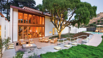 A contemporary home featuring a swimming pool and a spacious patio area for outdoor relaxation.