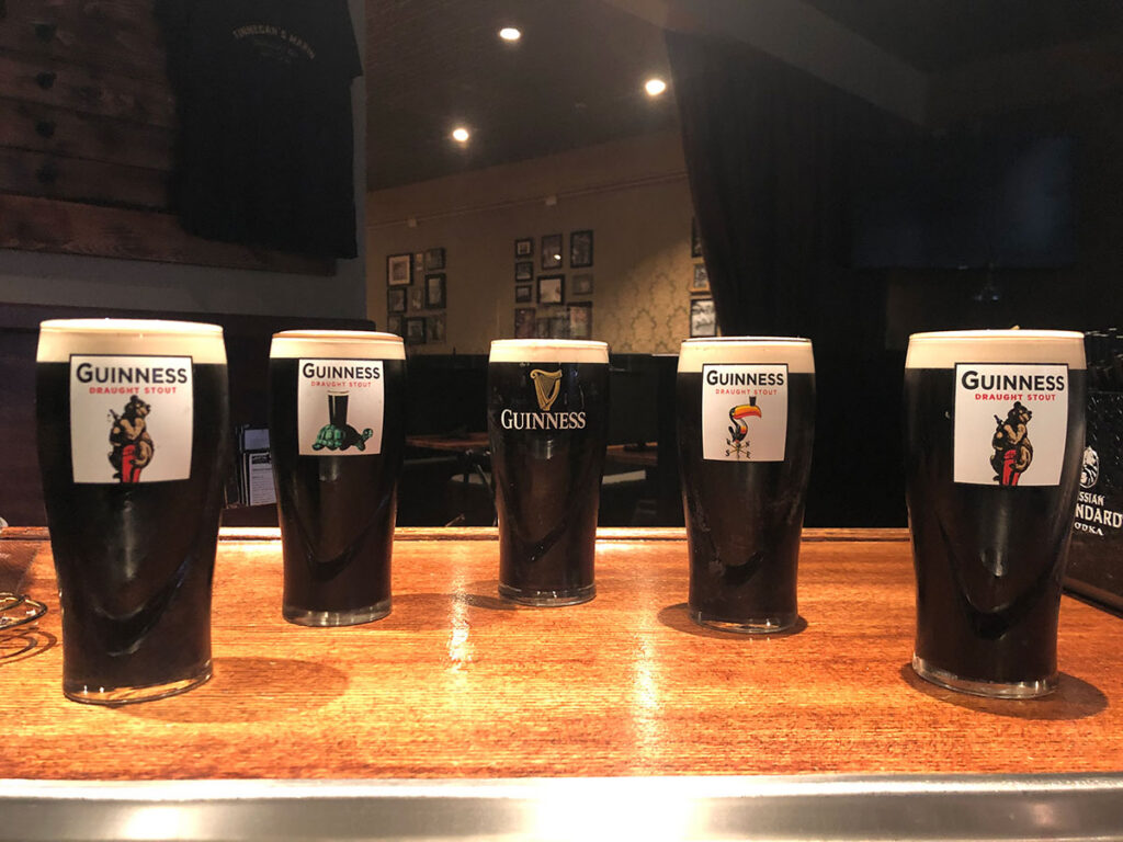 Five pints of Guinness on a table