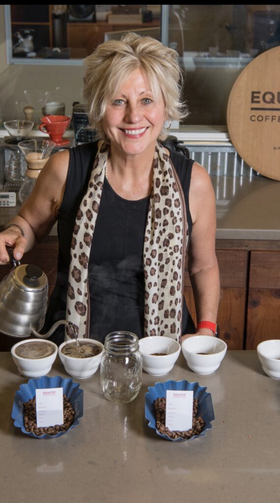 A headshot of Helen Russell of Equator Coffees pouring some coffee.