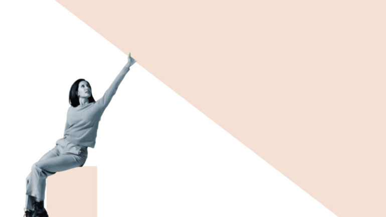 A woman in grayscale sits on a ledge, pointing upward with confidence. The background features a large beige triangle, creating a modern, dynamic feel.