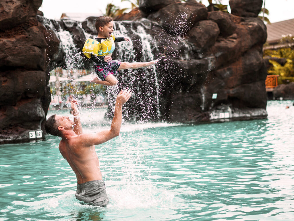 Father & Son Playing in the Main Pool