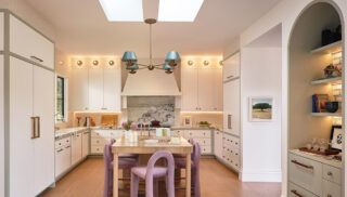 The focal point of the kitchen is the custom white oak and island — a modern interpretation of a classic English worktable.