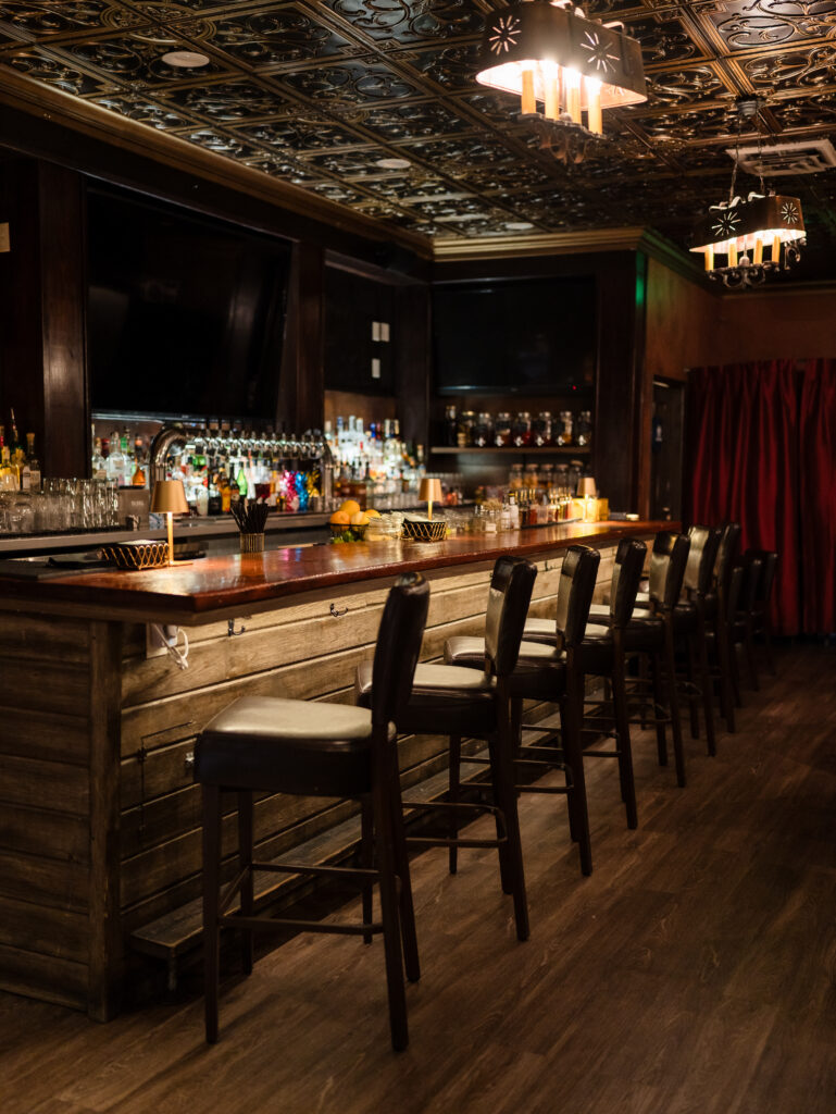 A dark, moody lit bar.