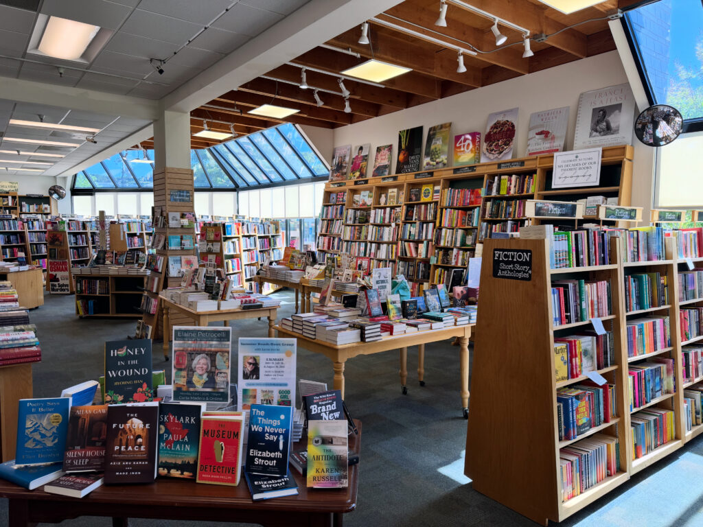 The interior of a bookstore, with books lining shelves.
