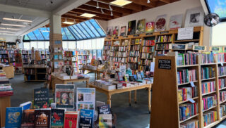 The interior of a bookstore, with books lining shelves.
