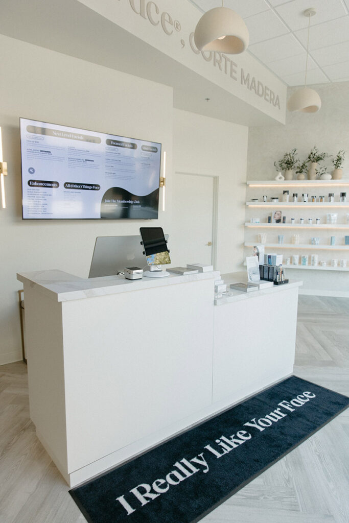 The reception desk and interior of a Face Foundrié