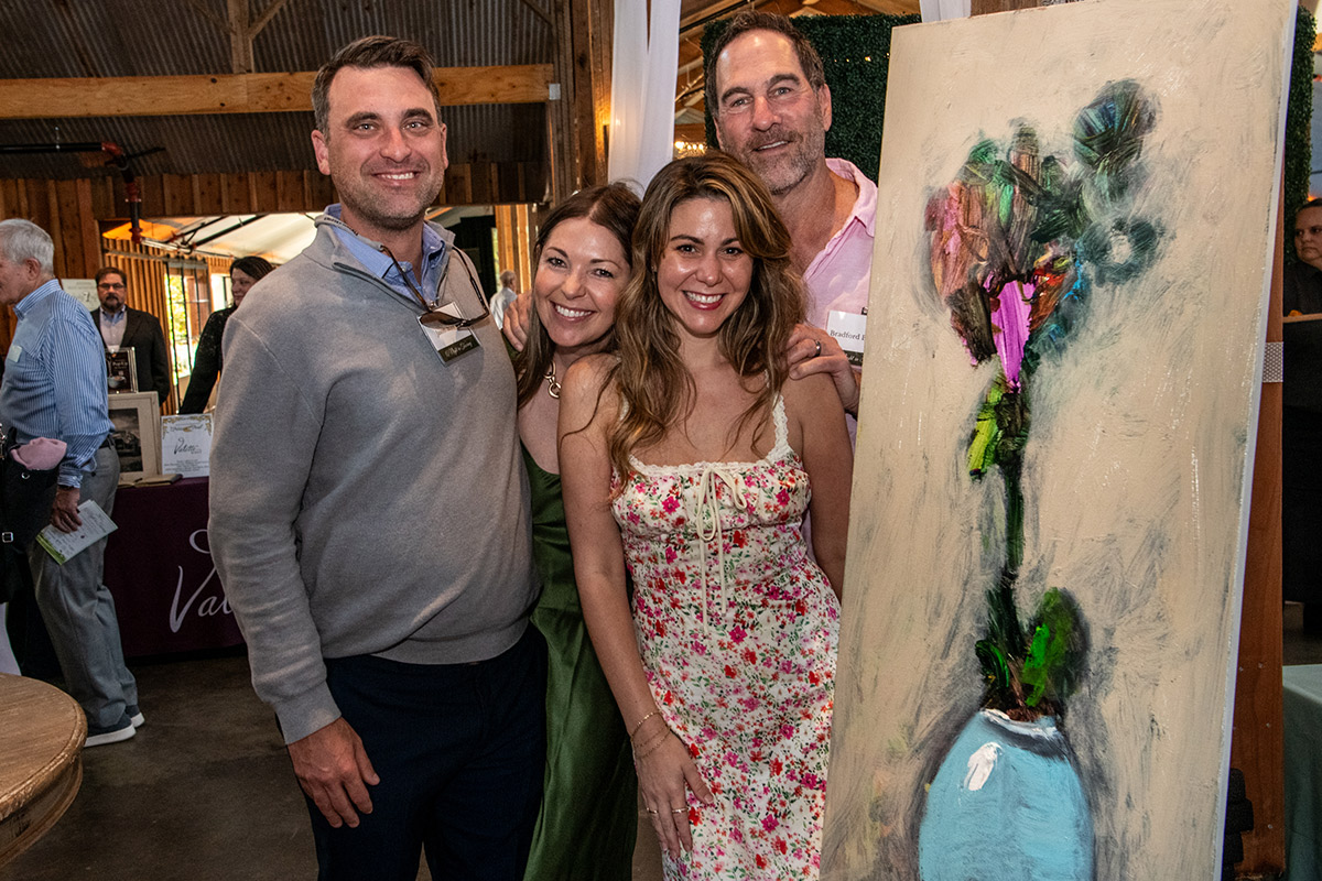 Artist Bradford Brenner with his live auction painting titled Kidding Around, made with children from NBCC Fitch Mountain, Photo Credit Stuart Lirette