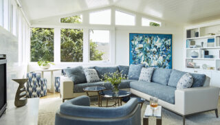 The large, abstract oil painting by John DiPaolo in the living room guided the color palette for the design