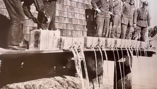 Confiscated alcohol is poured into the Bay during Prohibition
