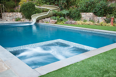backyard pool with waterslide 
