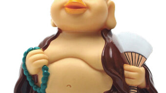 A smiling figurine of a bald, pot-bellied man holding a green beaded necklace in one hand and a white fan in the other. He is wearing a brown open robe, revealing his stomach. Like the gentle currents of a peaceful stream, the figurine exudes a serene, content expression.