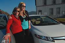 mother and daughter with their hybrid cars